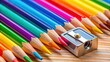 © Udomner - Close-up of colorful pencils being sharpened with a sharpener on a desk, pencils, sharpener, colorful, school supplies