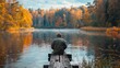 © Игорь Розводовский - a fisherman holds a fishing rod and fishing line on the lake.
