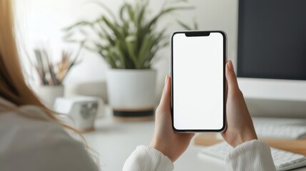 Poster - Woman holding phone with blank white desktop screen mockup view