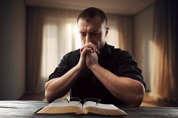 Canvas Print - Person sitting and studying scriptures The Holy Bible book