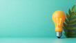 © Bi - Lightbulb with Green Leaf Minimalist Background for Creative Concepts