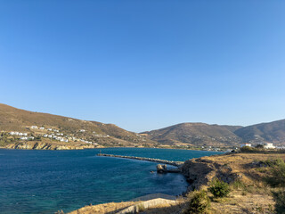 Wall Mural - Stone breakwater with a lighthouse at the port of Gavrio, Andros island Cyclades,