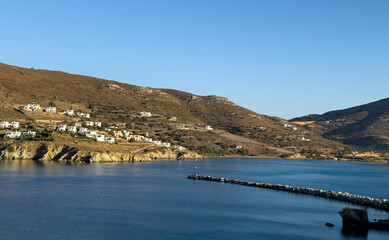 Wall Mural - Stone breakwater with a lighthouse at the port of Gavrio, Andros island Cyclades,