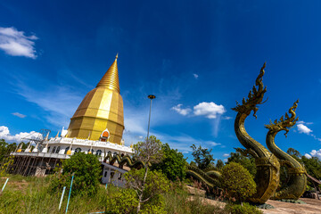 Background of religious tourist attraction, Wat Pa Dong Noi, in Noen Maprang District, Phitsanulok, Thailand, has a large Buddha statue for tourists to stop and make merit during their journey.