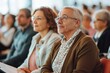 © DigitalMagicVisions - Active Senior Couple Attending Engaging Community Lecture with Bright Expressions, Wide-Angle Shot