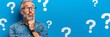 © Ilja - Thoughtful Senior Man, Many Questions on Blue Background Decision, Confusion, Dilemma Concept