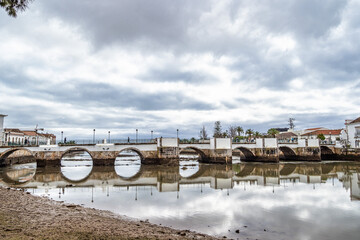 Roman bridge in Tavira, Algarve, Portugal. Ponte Romana bridge in Tavira town