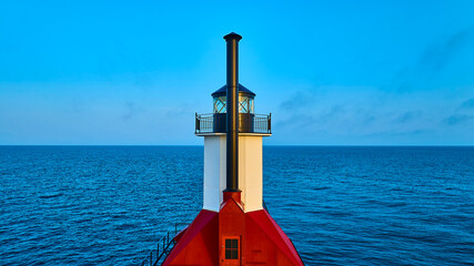 Aerial View of St. Joseph Lighthouse at Sunrise Over Calm Lake Michigan