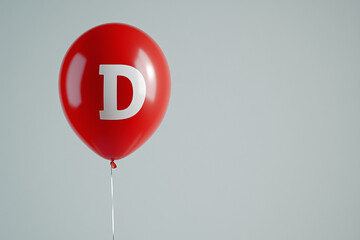 red balloon with white letter d for duchenne awareness day, promoting muscular dystrophy genetic dis