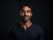 © Zakir - Headshot of a Smiling Man with Confident Expression in Dark Studio Setting