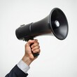 © DreamART - hand holding a megaphone, close-up, isolated on white background, clear detail, minimalistic design, studio lighting, realistic rendering