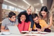 © BillionPhotos.com - Group of teenage happy students study in classroom library