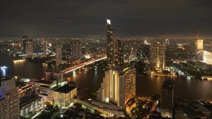 Canvas Print - Time lapse of aerial view of Bangkok Downtown. Financial district and business centers in smart urban city in Asia. Skyscraper and high-rise buildings. Thailand.