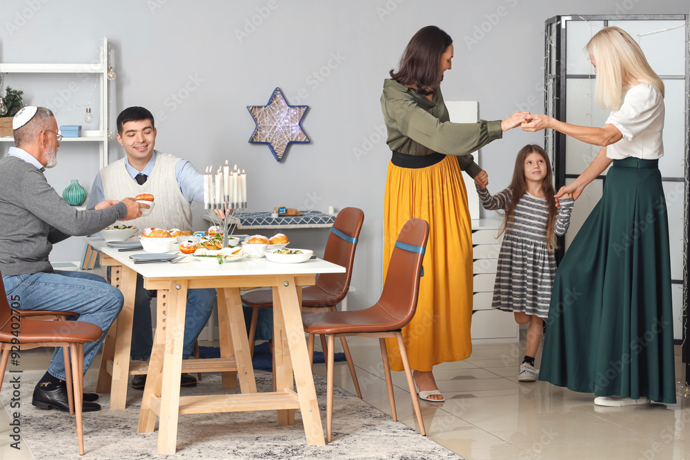 Happy family celebrating Hanukkah at home