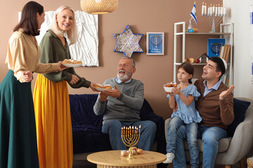 Poster - Happy Jewish family with donuts celebrating Hanukkah at home