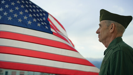 Elderly Man Stand Against American Flag For Veterans Day Holiday