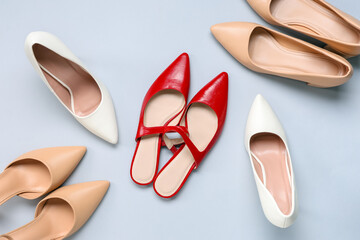 Wall Mural - High-heeled female shoes on white background. Top view