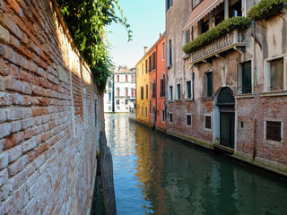 View of houses on a calm canal in Venice, Italy