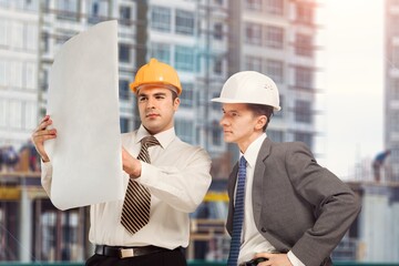 Wall Mural - Two engineer working at construction site building project,