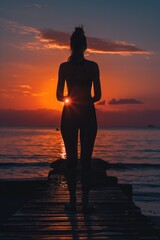 Aufkleber - A woman stands alone on a pier as the sun sets in the background
