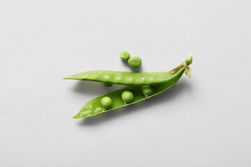 Wall Mural - Green peas on light background