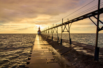 Lighthouse at Sunset with Pier Reflection Low Eye-Level Perspective