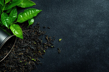 Wall Mural - A black background with a cup of tea leaves and a bunch of tea leaves on it