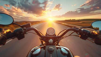 Poster - A person rides a motorcycle down a winding road as the sun sets in the background
