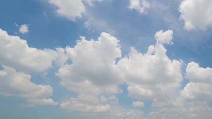 Wall Mural - Time lapse of clear blue sky with white fluffy clouds at noon. Day time. Abstract nature landscape background.