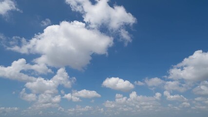 Wall Mural - Time lapse of clear blue sky with white fluffy clouds at noon. Day time. Abstract nature landscape background.