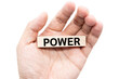© Wongsakorn - Text POWER wooden block on hand. isolated on white background and clipping path.