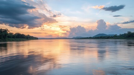 Wall Mural - A boat is traveling down a river with a beautiful sunset in the background