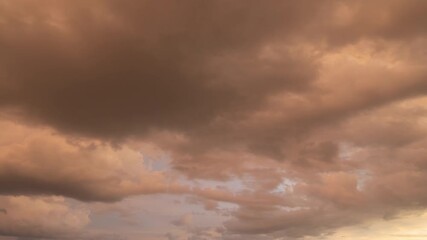 Wall Mural - Time lapse of sunset sky. Abstract nature background. Dramatic blue with orange colorful clouds in twilight time.