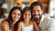 © Рудой Максим - Happy family of three smiling together indoors during the day