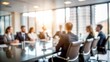 © Mari - Unfocused Executive Meeting - Gentle blur effect of an executive meeting scene with people and office decor.