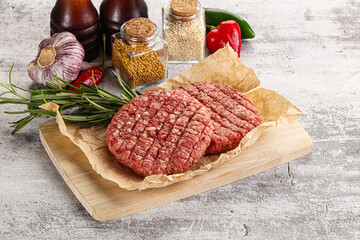 Canvas Print - Raw burger cutlet for grill