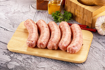 Canvas Print - Raw meat sausages for grill