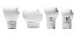 © tohceenilas - Four sets of white boxing gloves arranged in a precise lineup, showcasing their unique designs and padding features.