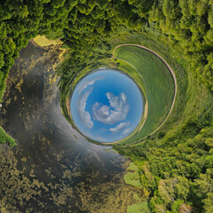 Panoramic view from drone, green little planet and blue sky around the globe