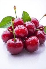 Wall Mural - White background with red cherries and a water drop