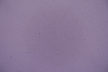 Close shot of muted grey mauve painted wall