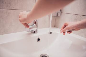 Poster - Cropped photo of girl hands arms preparing brushing teeth indoors house apartment washroom