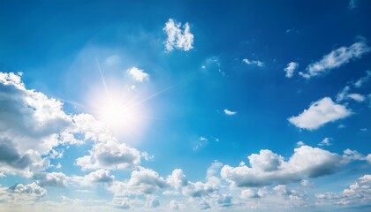 blue sky with clouds and sun reflection.The sun shines bright in the daytime in summer