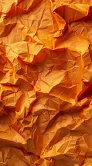 Poster - Rich, vibrant orange paper displays an intricate crumpled texture, perfect for backgrounds or artistic endeavors
