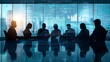 © Phichaphat - Silhouettes of Business People Meeting in Modern Office