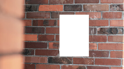 Wall Mural - Blank white poster taped on red brick wall partially obstructed by another brick structure on left. Tape is slightly visible securing poster against weathered and uneven brick surface