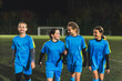 © PoppyPix - four teenage girls in blue soccer uniforms posing, teamwork and girls soccer concept. High quality photo