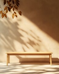 Wall Mural - A minimalist wooden bench against a beige wall with delicate shadows of leaves and branches, creates a serene atmosphere for product photography