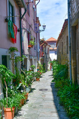 Facade of colorful buildings among the streets of the old city in Porto, Portugal.