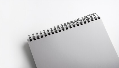 Wall Mural - paper spiral notebook close up isolated on a white background blank background